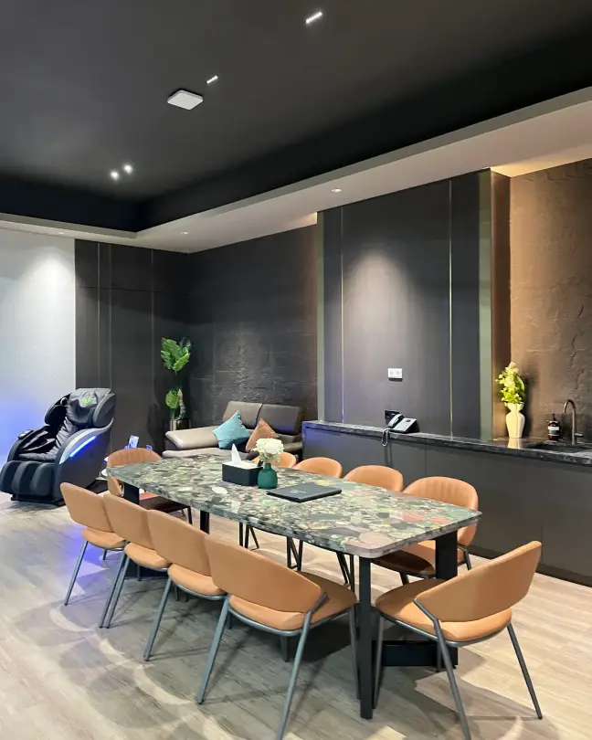 A VIP lounge with a marble table and massage chair