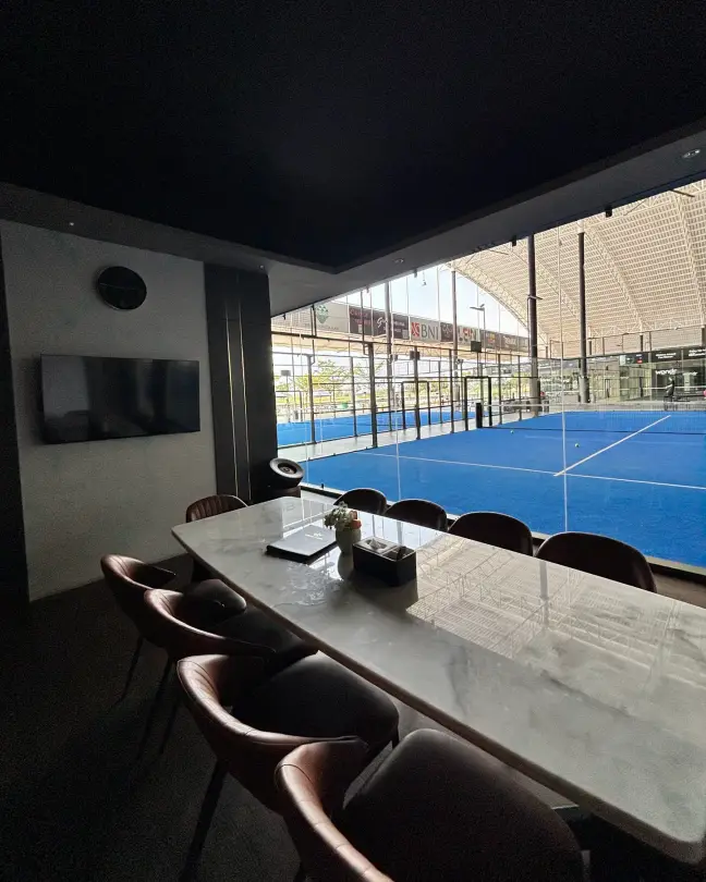 A VIP room looking out onto a blue court